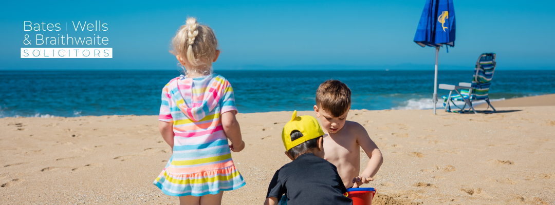 Can my ex stop me taking my children on holiday? Children playing on a beach